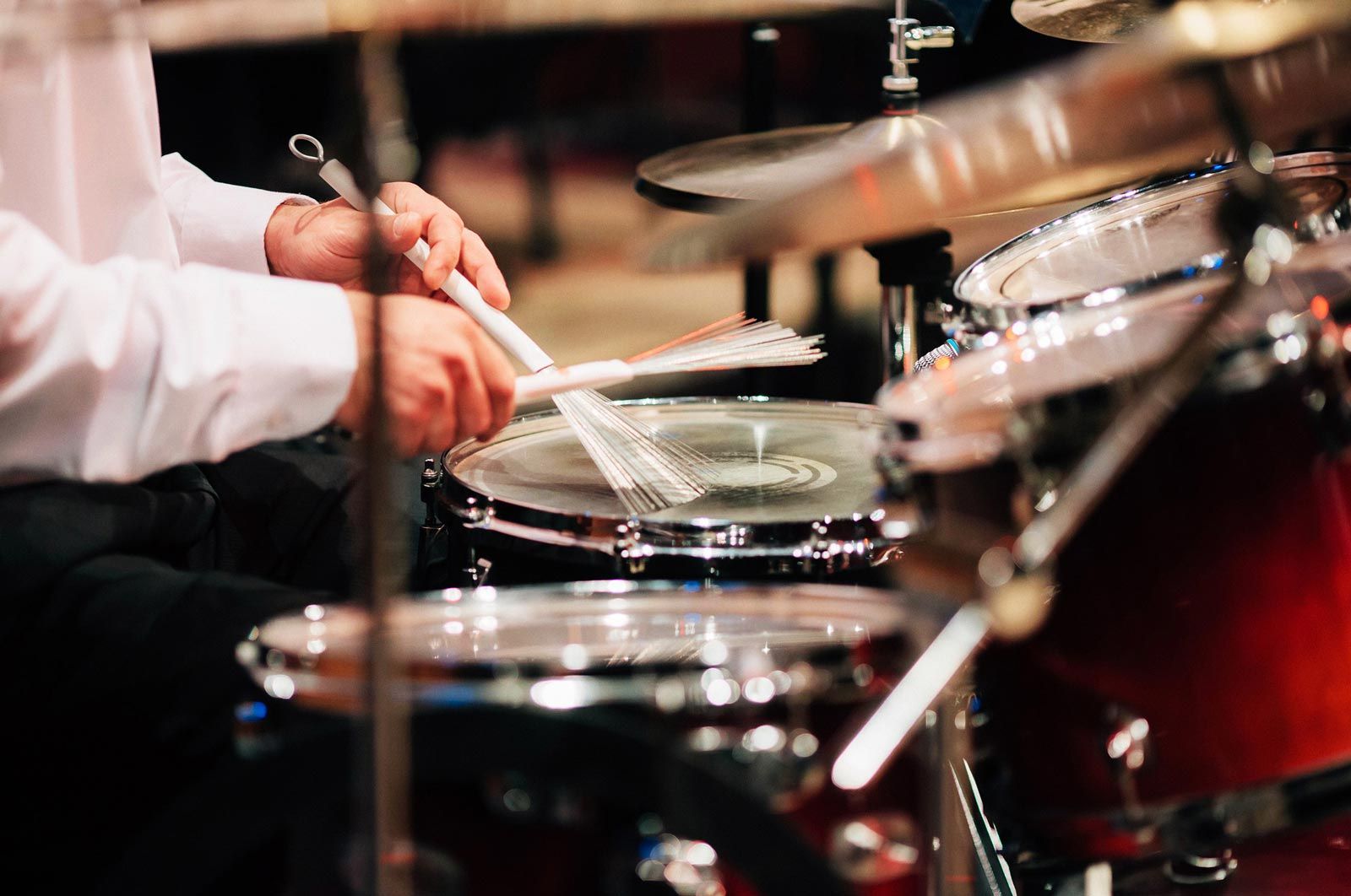 drummer playing drums with brushes